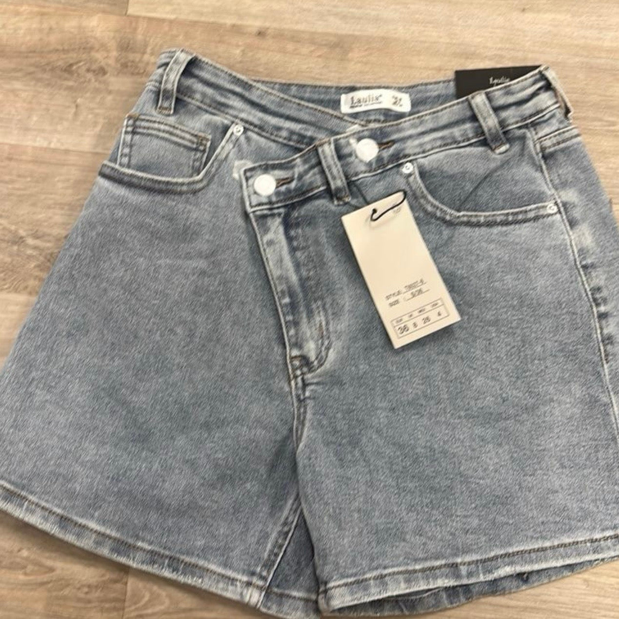 Asymmetric waist denim shorts